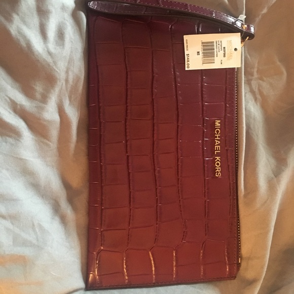 Michael Kors Handbags - Michael Kors clutch new with tags